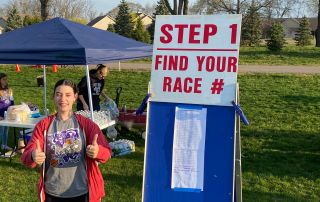 Volunteer helping with race registration