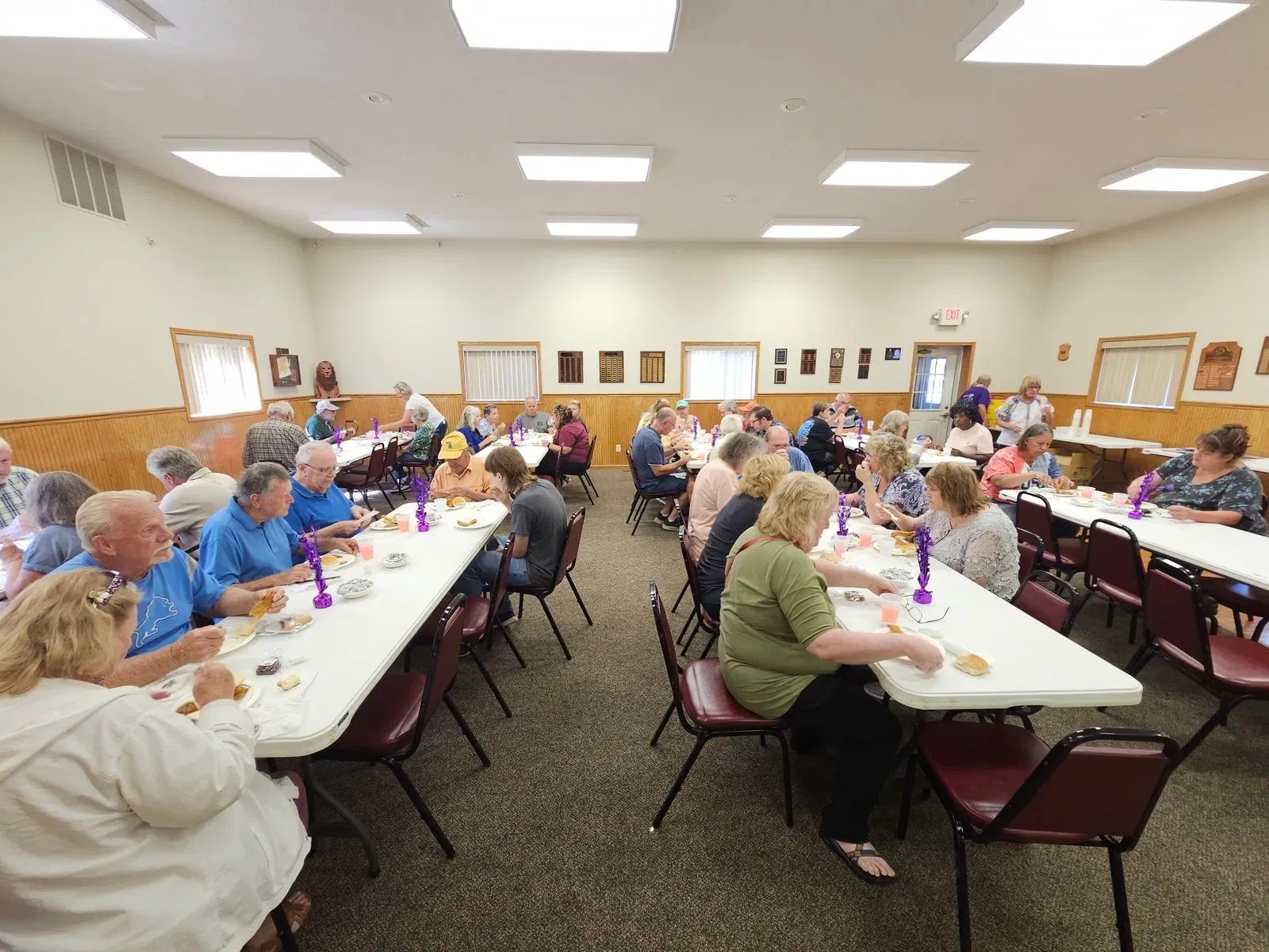 Community members enjoying their all-you-can-eat fish fry dinner