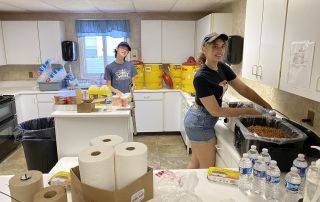 Volunteers working in the kitchen during the fish fry