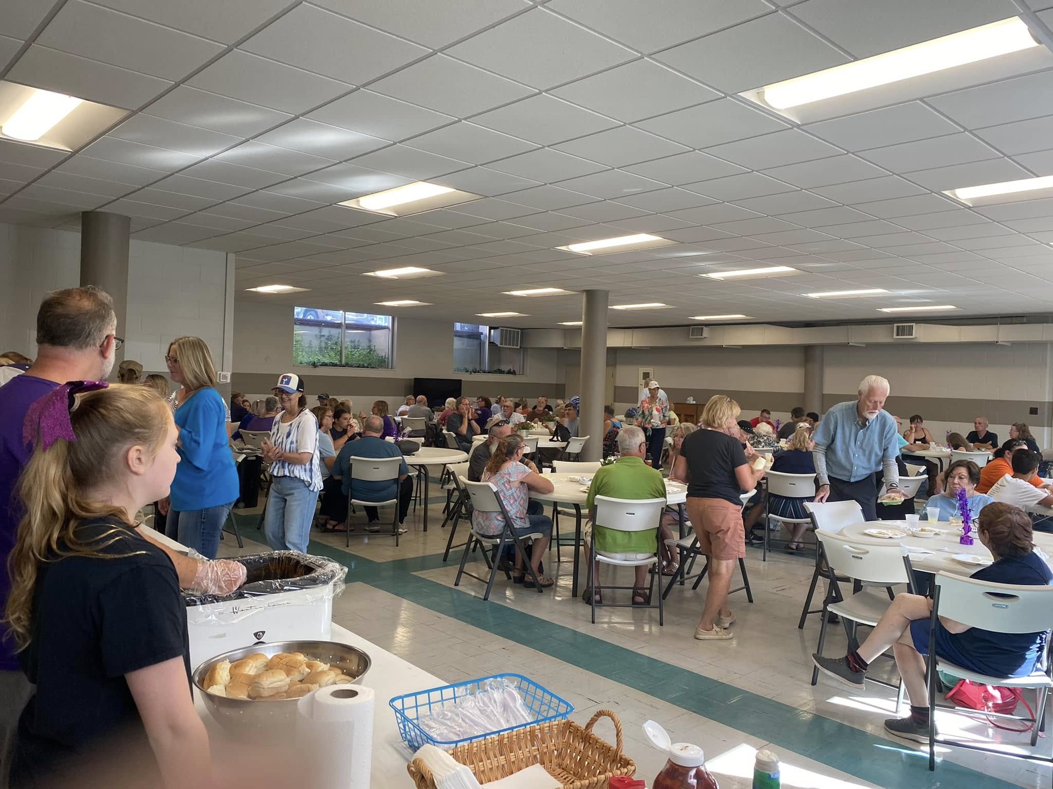 Members of the community enjoy a fish dinner supporting the Three Rivers Promise